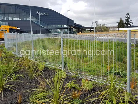 Galvanized roll top fence used to protect the plant